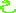 A green snake, coiled at the base with its head raised.